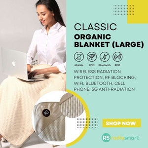 May include: A large, beige organic blanket with a white stripe pattern. The blanket is labeled "Classic Organic Blanket (Large)" and features icons for mobile, WiFi, Bluetooth, and RFID. The text "Wireless Radiation Protection, RF Blocking, WiFi, Bluetooth, Cell Phone, 5G Anti-Radiation" is also included. The blanket is shown draped over a person sitting on a chair with a laptop. The text "Shop Now" and "RS radiosmart" are also included.