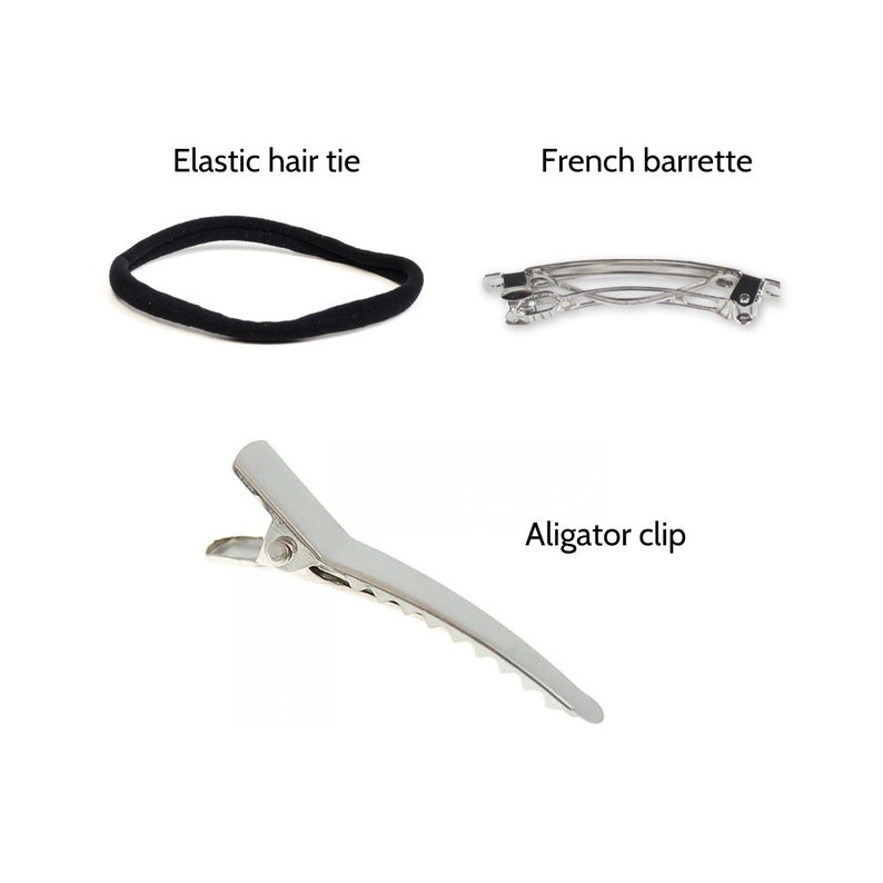K&ouml;nnte beinhalten: Drei Haarschmuckst&uuml;cke: ein schwarzes Gummiband, eine silberne Alligator-Klammer und eine silberne franz&ouml;sische Barrette.