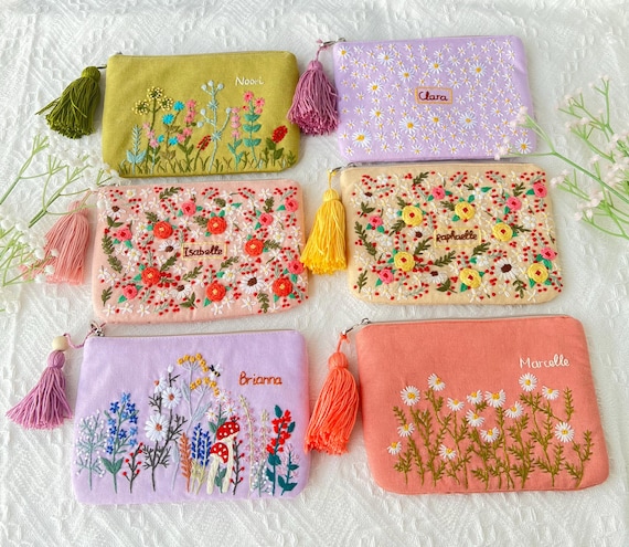 Embroidered makeup pouch deals