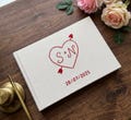 Custom Hand Embroidered Guest Book, Photo Album, Heart Arrow Design, Linen Wedding Guest Book, Memory Book, Handmade Fabric Notebook product logo