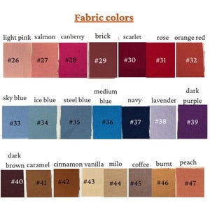 May include: A color chart titled Fabric colors displaying twenty-two fabric swatches arranged in three rows. Each swatch is labeled with a number from 26 to 47 and a corresponding color name including light pink, salmon, cranberry, brick, scarlet, rose, orange red, sky blue, ice blue, steel blue, medium blue, navy, lavender, dark purple, dark brown, caramel, cinnamon, vanilla, milo, coffee, burnt, and peach.