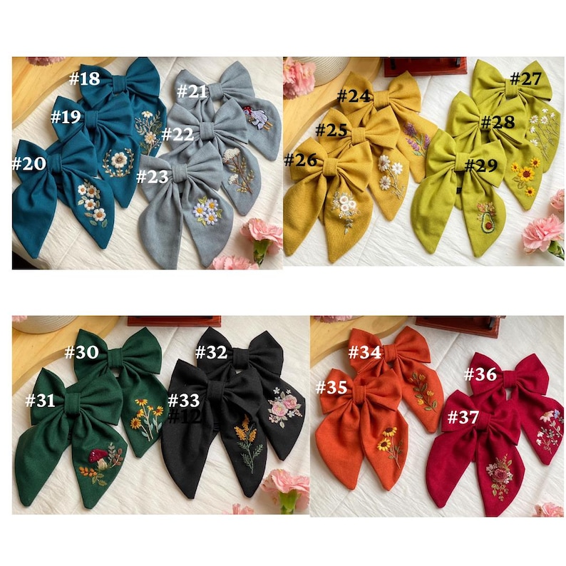 K&ouml;nnte beinhalten: Ein Set mit 37 handgefertigten Stoffhaarb&auml;ndern mit gestickten Blumenmustern. Die Schleifen sind in verschiedenen Farben, darunter T&uuml;rkis, Gelb, Gr&uuml;n, Schwarz, Rot und Orange.