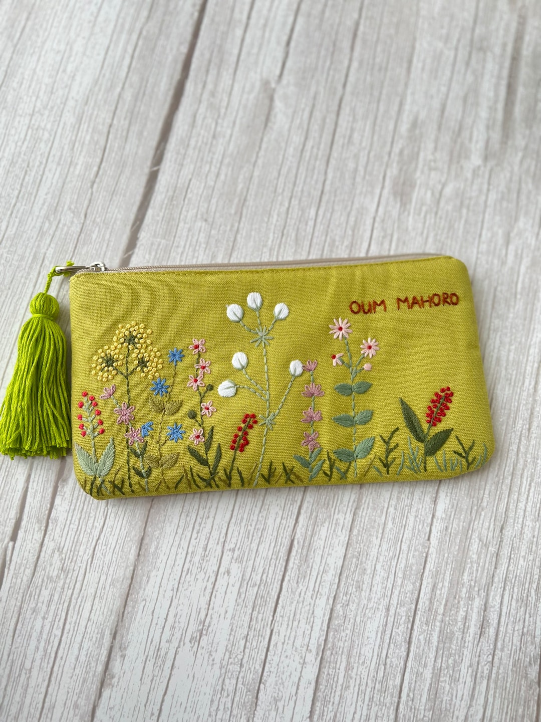 Pink hand embroidered lune bag