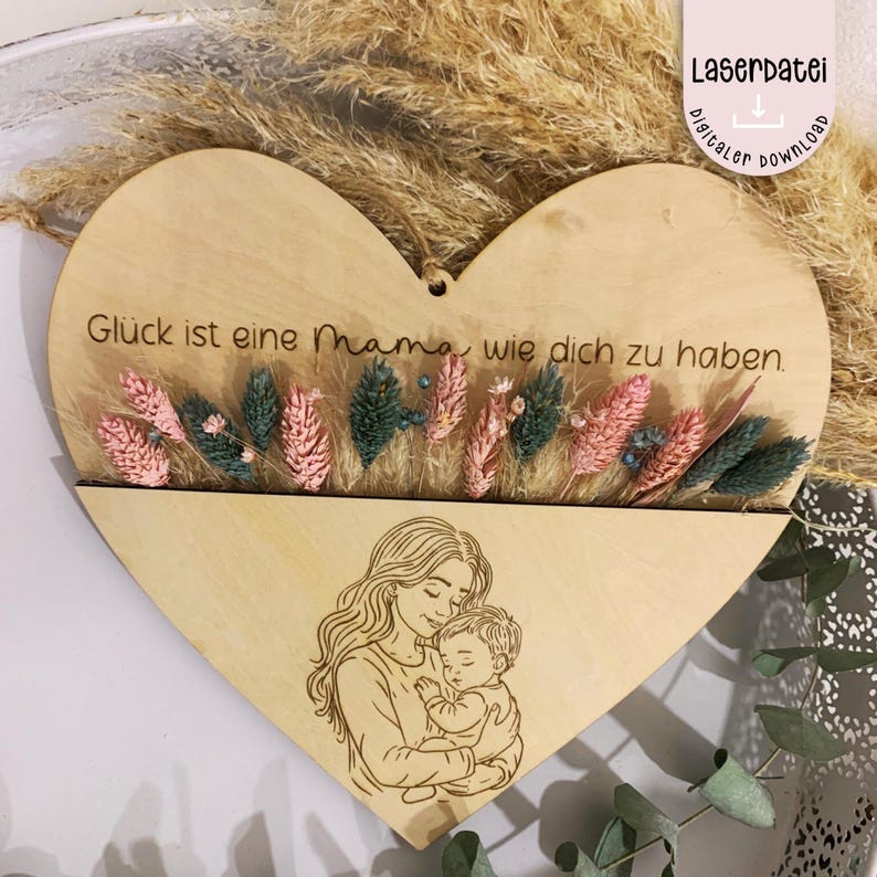 May include: A wooden heart-shaped plaque with a cutout for dried flowers. The plaque is engraved with the text "Gl&uuml;ck ist eine Mama wie dich zu haben." and a drawing of a mother holding a baby.