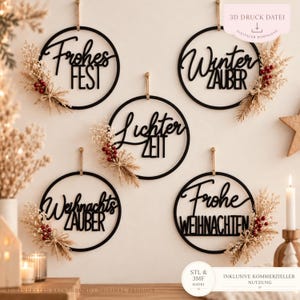 May include: Five circular black wall decorations featuring German text: Frohes Fest, Winter Zauber, Lichter Zeit, Weihnachts Zauber, and Frohe Weihnachten. Each hoop is accented with dried beige grasses and small red berries, suspended by twine.