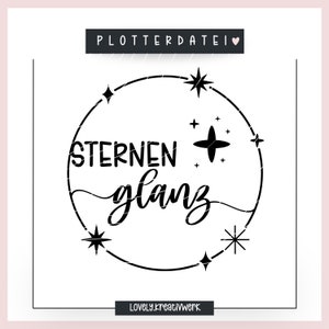 May include: Black and white design with a circle and stars. The text inside the circle reads "Sternen + Glanz" and "Lovely.kreativWerk" is below the circle.