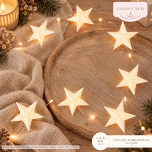 May include: A string of white star-shaped lights with a thin wire, featuring six illuminated stars. The image includes text that reads 3D DRUCK DATEI, DIGITALER DOWNLOAD, STL & 3MF DATEI, and INKLUSIVE KOMMERZIELLER NUTZUNG.