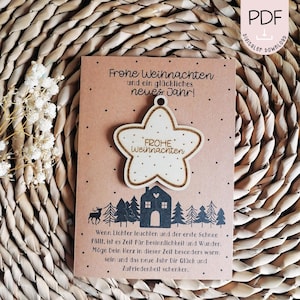 May include: A brown card with the text "Frohe Weihnachten und ein gl&uuml;ckliches neues Jahr!" and a wooden star ornament with the text "FROHE Weihnachten" on it. The card has a winter scene with a house and trees.