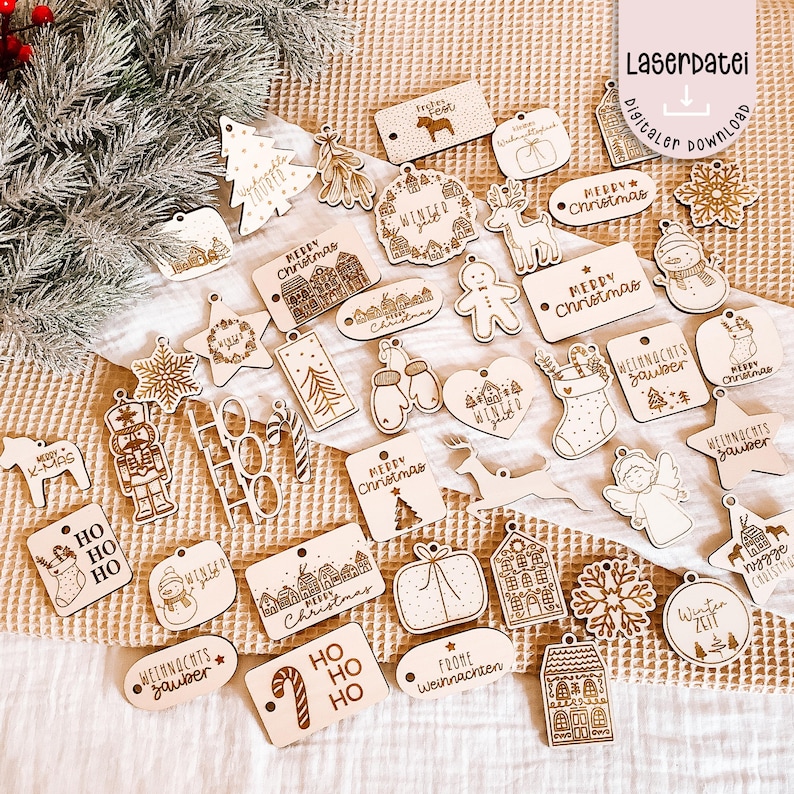 May include: A collection of laser-cut wooden Christmas ornaments in various shapes, including stars, snowflakes, and gift boxes. Many ornaments feature festive text like "Merry Christmas" and "Winter". The ornaments are light brown with etched designs.