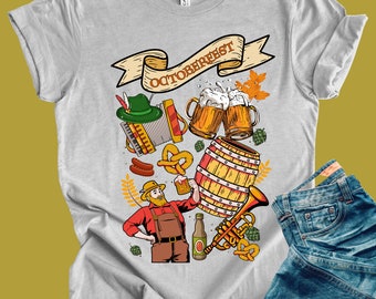 May include: A light gray t-shirt with a colorful Oktoberfest design. The graphic includes beer steins, a barrel, a man in traditional attire, pretzels, and the word "Oktoberfest" on a banner.