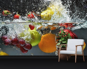 May include: A variety of fresh fruit, including grapes, pears, apples, oranges, and strawberries, are submerged in water, creating a splash of water droplets. A white armchair sits in the foreground.