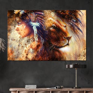 May include: A canvas print featuring a woman in profile with Native American headdress and a lion's face. The artwork uses warm tones of brown, gold, and orange with paint splatter effects, creating a textured and artistic look.
