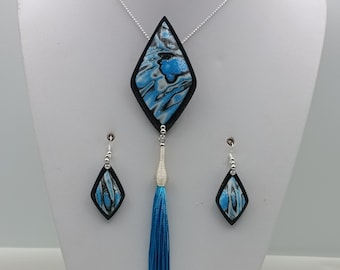 Silver ball chain necklace, black and blue glitter pendant with blue pompom and matching earrings