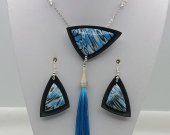 Geometric necklace with black and blue polymer pendant, blue pompom, silver chain and pearls and matching earrings