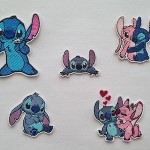 May include: Five embroidered patches featuring the character Stitch from Lilo & Stitch. The patches are in various poses and colours, including blue, pink, and grey. The patches are designed for clothing or accessories.