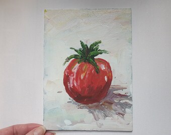 May include: A red tomato with green leaves painted on a white canvas.