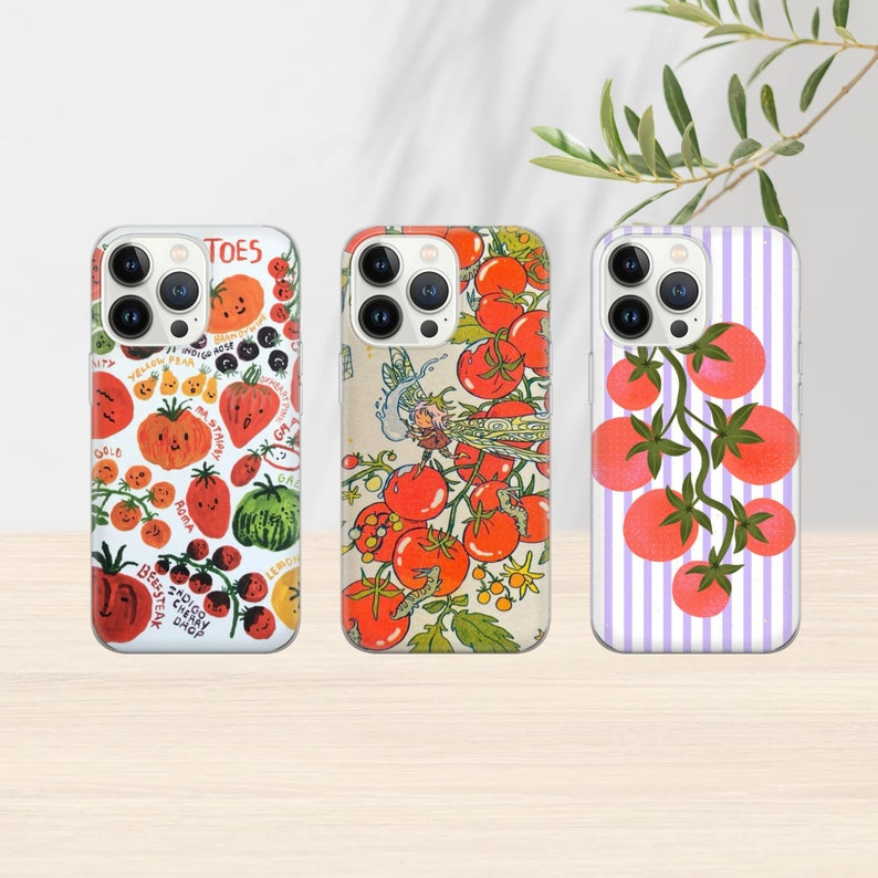 May include: Three iPhone cases with different designs featuring red tomatoes. The first case has a white background with a variety of red tomatoes, green leaves, and the text "TOES". The second case has a white background with a red tomato vine with green leaves and a small butterfly. The third case has a purple and white striped background with a red tomato vine with green leaves.