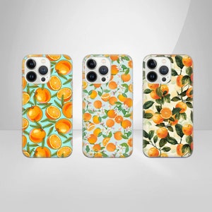 May include: Three clear phone cases featuring a design of orange slices and green leaves on a light blue background. The cases are designed for an iPhone 14 Pro.