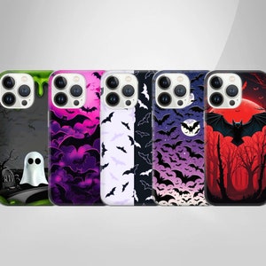 May include: Five different iPhone cases with Halloween themes. The cases feature bats, ghosts, and a spooky forest scene. The cases are all black and feature different colors and designs.