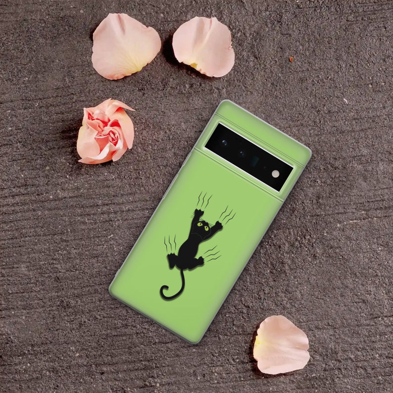 May include: A green phone case with a black cat scratching its way up the side. The cat has green eyes and is silhouetted against the green background.