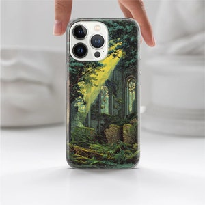 May include: A clear phone case with a colorful image of a stone building overgrown with green vines and trees. The building has large windows and a yellow glow coming from inside.