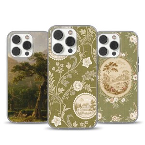 May include: Three iPhone cases with varied designs. One case displays a landscape painting with a prominent tree. Another features a green floral pattern with white flowers. The third has a green floral pattern with a circular landscape scene.