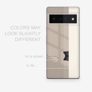 May include: A beige and white phone case with a black cat peeking out from behind a white stripe. The case has a camera cutout with three lenses and the text "DON'T LOOK" on the white stripe.
