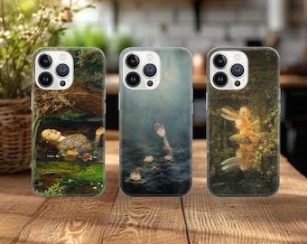 May include: Three phone cases with artistic designs. One case features a painting of a woman floating in water, another shows a hand reaching out of water, and the third depicts a fairy in a forest setting.