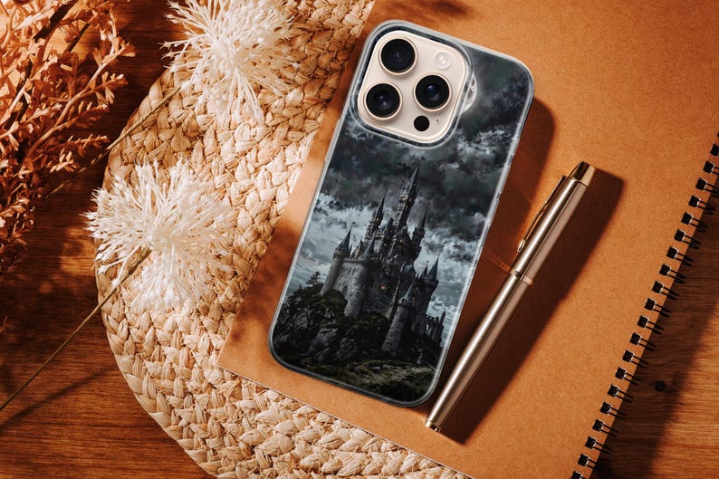 Dark fantasy phone case design depicting a gothic castle standing on a rocky hill beneath stormy clouds. The artwork uses deep black, gray, and muted blue tones to create a dramatic and mysterious atmosphere. The castle appears powerful and ancient, surrounded by mist and shadow, evoking themes of dark fantasy, mystery, and epic storytelling. This moody illustration is ideal for fans of gothic and fantasy aesthetics.
