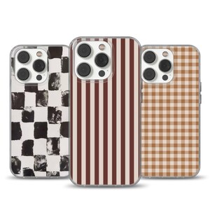 May include: Three phone cases with different patterns. One case has a black and white checkered design, another has vertical brown and white stripes, and the third has a brown and white gingham pattern. All cases have a clear border.