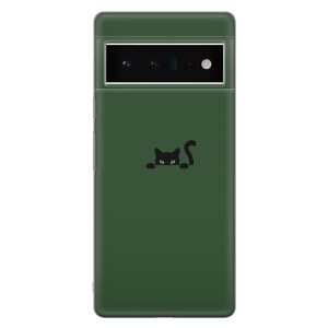 May include: A dark green phone case with a black cat peeking out from behind a corner. The cat has green eyes.