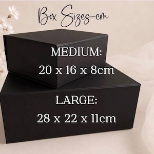May include: Two black rectangular boxes, one stacked on the other. The top box is labeled "MEDIUM" and measures 20 x 16 x 8cm. The bottom box is labeled "LARGE" and measures 28 x 22 x 11cm. The text "Box Sizes-cm" is at the top.