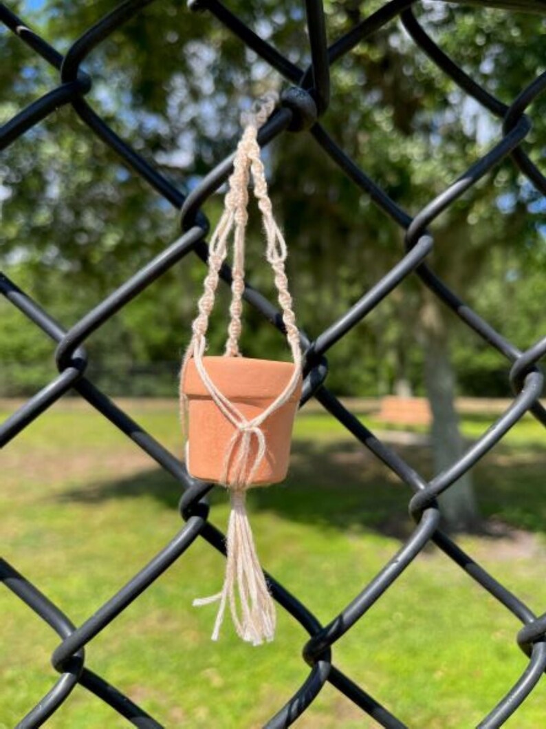 Single Square knots create a twisting pattern with an open square not in the center to create a break in the cord