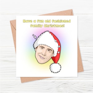 May include: A Christmas card featuring a cartoon illustration of a man wearing a Santa hat. The text on the card reads "Have a fun old fashioned family Christmas!"