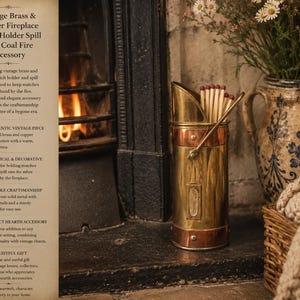 May include: A vintage brass and copper match holder and spill vase, designed for the fireplace. The cylindrical container has a copper band and handle. The image text reads "Vintage Brass & Copper Fireplace Match Holder Spill Vase Coal Fire Accessory."
