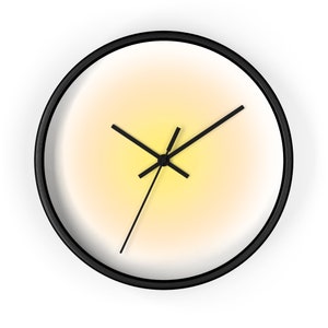 May include: A round wall clock with a black frame. The clock face has a gradient of yellow to white, and black hands. The clock is a simple, modern design.