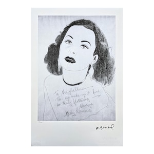 May include: Monochrome portrait of a woman with dark hair and dark lipstick. The image includes text that reads "To Maybelline, The eye make-up I find so truly flattering. Always, Hedy Lamarr."