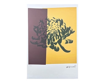 May include: A black and green stylized flower print on a yellow and brown background. The print is signed "Agam" in the bottom right corner.