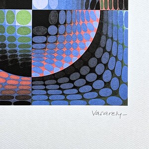 May include: Abstract geometric artwork featuring a colorful pattern of shapes and forms. The design incorporates blue, orange, green, and black elements, with a signature that reads "Vasarely-" in the bottom right corner. The artwork is on a white background.