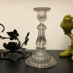 Three delightful single flame candle holders. One in crystal, one in ceramic sparrow on a branch and one in hand-made wrought iron.