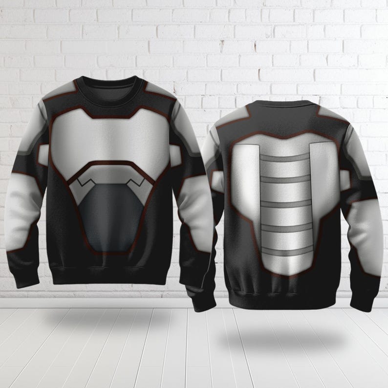 May include: A black sweatshirt with a futuristic design, featuring a white and gray chest plate and accents. The back of the sweatshirt also displays a similar design. The overall aesthetic is reminiscent of a superhero or sci-fi theme.