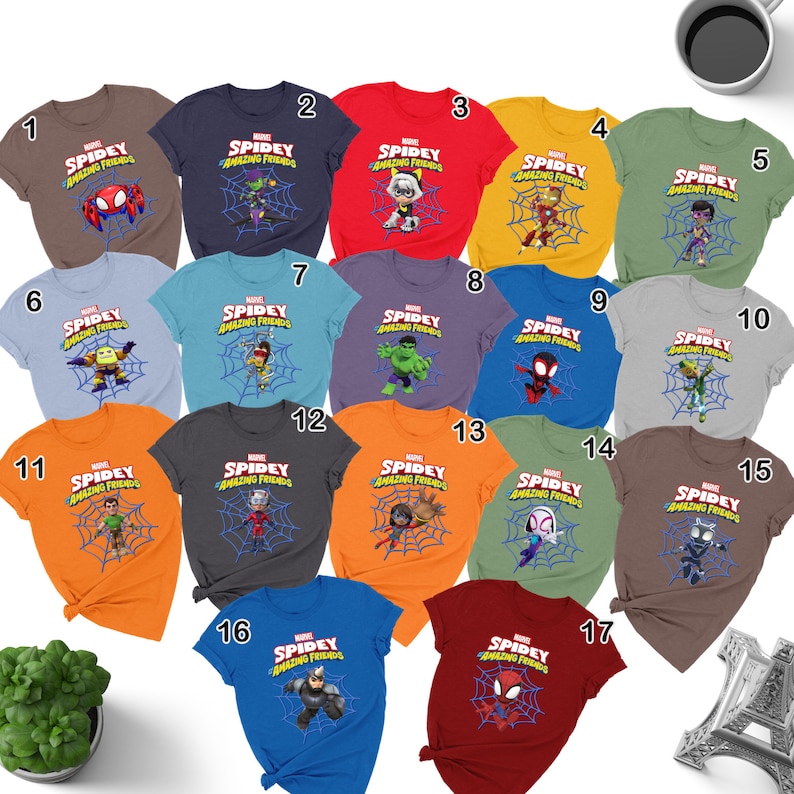 May include: A set of 17 t-shirts featuring different Marvel characters from the Spidey and His Amazing Friends cartoon. The shirts are in various colors, including red, blue, green, orange, and gray. Each shirt features a different character, such as Spidey, Ghost-Spider, Hulk, and Green Goblin.