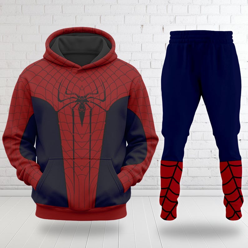 A Spiderman-themed hoodie and pants are displayed against a white brick wall.