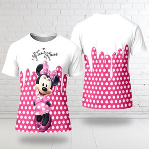 A white t-shirt with a pink polka dot pattern and a Minnie Mouse graphic printed on it.