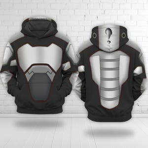 May include: Two black hoodies with a futuristic design. The front of the hoodies feature a silver and gray chest plate design with black accents. The back of the hoodies have a silver and gray design with a question mark on the hood.