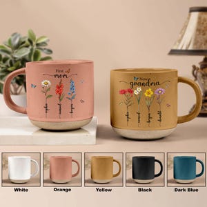 May include: Set of 10 personalised coffee mugs with different colour options. The mugs feature a floral design with the text "First Mom" and "Now Grandma" and names of family members. The mugs are available in white, orange, yellow, black, and dark blue.