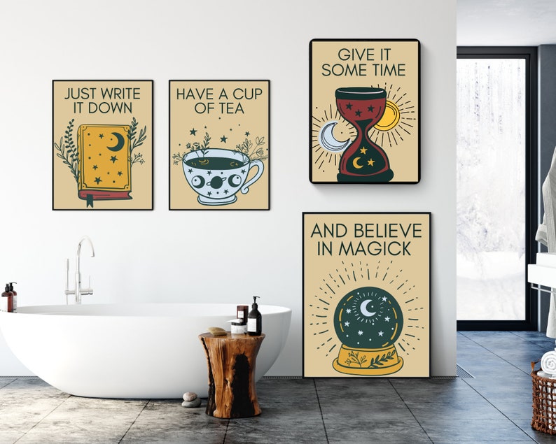 May include: Four beige framed prints with black text and illustrations. The prints feature quotes about writing, tea, time, and magic. The prints are hanging on a white wall in a bathroom with a white bathtub and a wooden stool.
