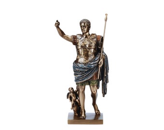 May include: A bronze statue of a Roman emperor in a gold and blue toga, holding a spear and standing on a base with a smaller bronze statue of a winged figure.