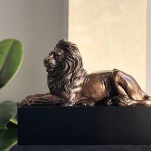 Lion Figurine Lying on a Pedestal, Bronze Lion Statue.