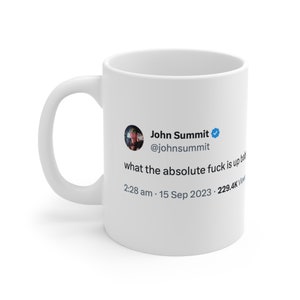 May include: White ceramic mug with a blue and white Twitter post printed on it. The post reads "John Summit @johnsummit what the absolute fuck is up baby 2:28 am - 15 Sep 2023 - 229.4K Views".